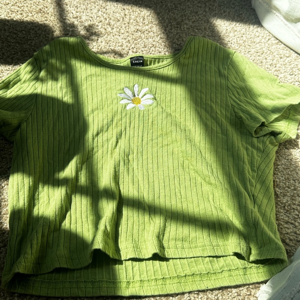 Green shirt with a flower in the mail from SHEIN